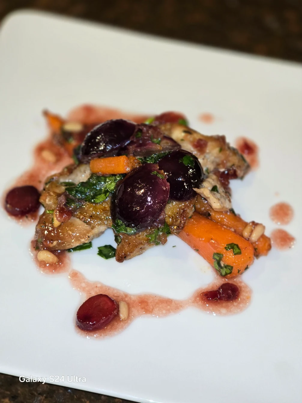 Quail served with grapes, vegetables and verjus sauce.